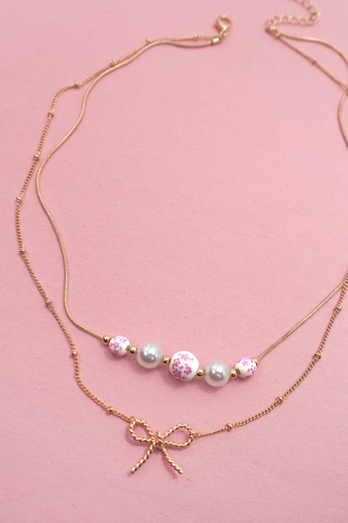 JOSSLYN by Wall to Wall - PINK CERAMIC PORCELAIN PEARL BOW LAYER NECKLACE | 80N91556