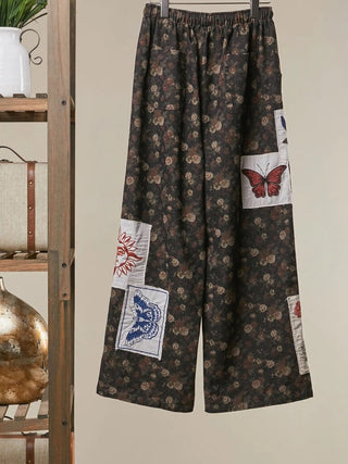 Dark floral wide-leg pants with botanical patchwork and drawstring waist, alternate view 2