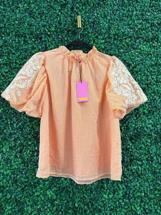 THML orange mock neck striped top, front view